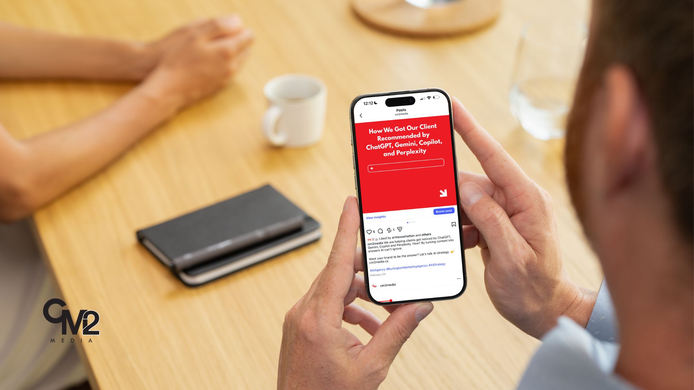 Faceless man looking at a phone - AI search tips from CM2 Media.