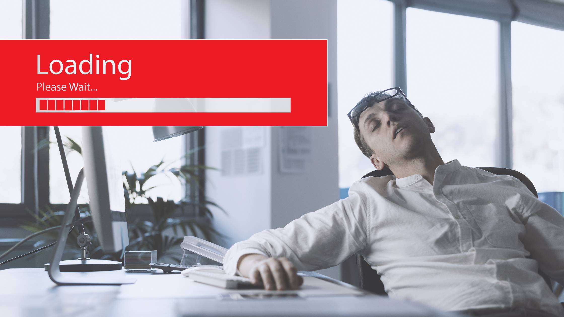 Frustrated man at a desk - website design mistakes.